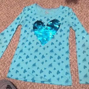 Long sleeved shirt with double sided sequins